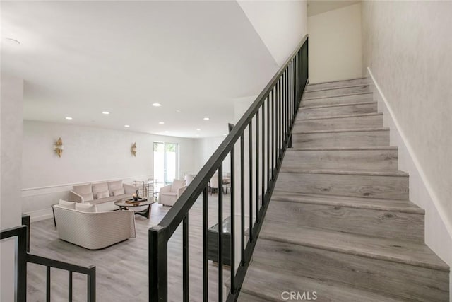 9124 N Nilo Ln, Panorama City, CA 91402 - stairway featuring wood finished floors and recessed lighting