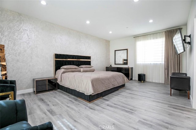 9124 N Nilo Ln, Panorama City, CA 91402 - bedroom featuring wood finished floors, a textured wall, and recessed lighting