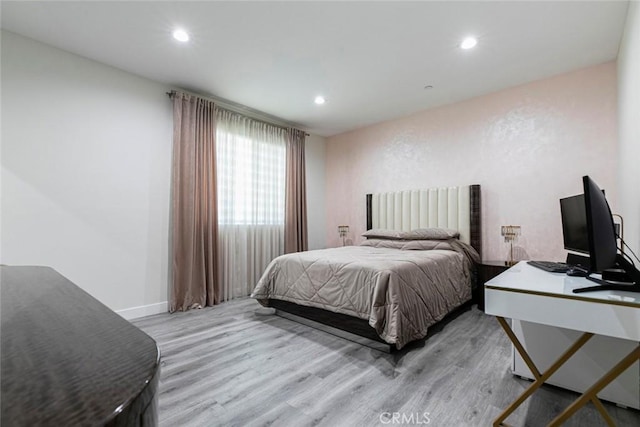 9124 N Nilo Ln, Panorama City, CA 91402 - bedroom with light wood finished floors, recessed lighting, and an office area