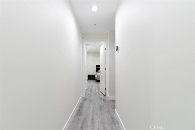 9124 N Nilo Ln, Panorama City, CA 91402 - hall with light wood-style flooring and recessed lighting
