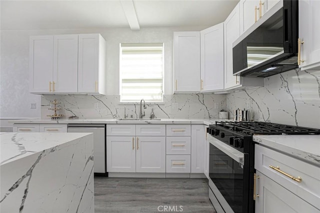 9124 N Nilo Ln, Panorama City, CA 91402 - kitchen with stainless steel appliances, white cabinets, tasteful backsplash, light stone countertops, and light wood finished floors