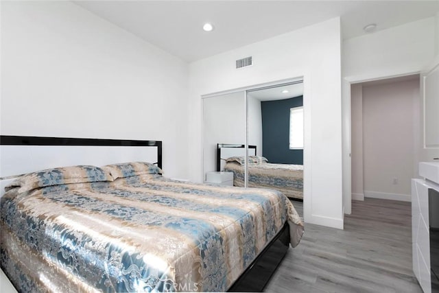 9124 N Nilo Ln, Panorama City, CA 91402 - bedroom with light wood-type flooring, recessed lighting, and a closet