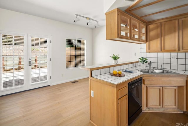 3531 Columbia St, San Diego, CA 92103 - kitchen featuring dishwasher, tile countertops, light wood-style flooring, and backsplash
