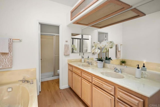3531 Columbia St, San Diego, CA 92103 - full bathroom with wood finished floors, double vanity, a stall shower, and a garden tub