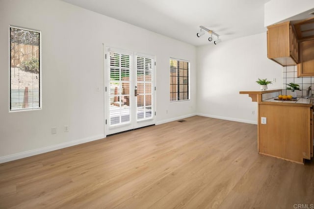 3531 Columbia St, San Diego, CA 92103 - unfurnished dining area with light wood-style flooring and rail lighting