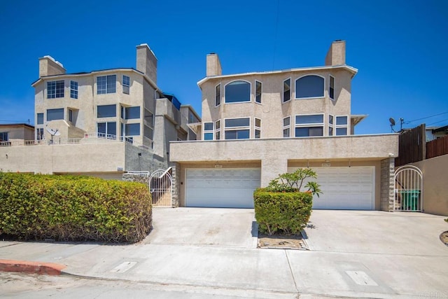 3531 Columbia St, San Diego, CA 92103 - view of front of property featuring an attached garage, driveway, a gate, and a chimney