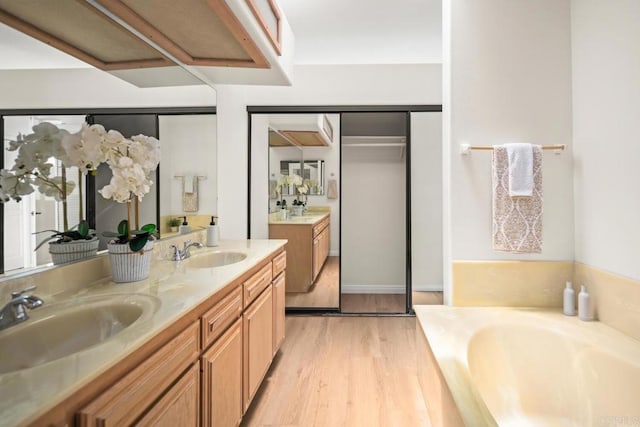 3531 Columbia St, San Diego, CA 92103 - full bath featuring double vanity, a garden tub, and wood finished floors