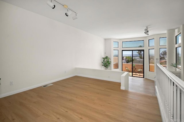 3531 Columbia St, San Diego, CA 92103 - unfurnished room with track lighting and light wood-type flooring