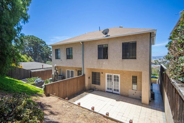 3531 Columbia St, San Diego, CA 92103 - rear view of house with stucco siding, a fenced backyard, a patio, and french doors