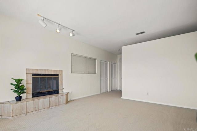 3531 Columbia St, San Diego, CA 92103 - unfurnished living room featuring carpet floors, track lighting, and a fireplace
