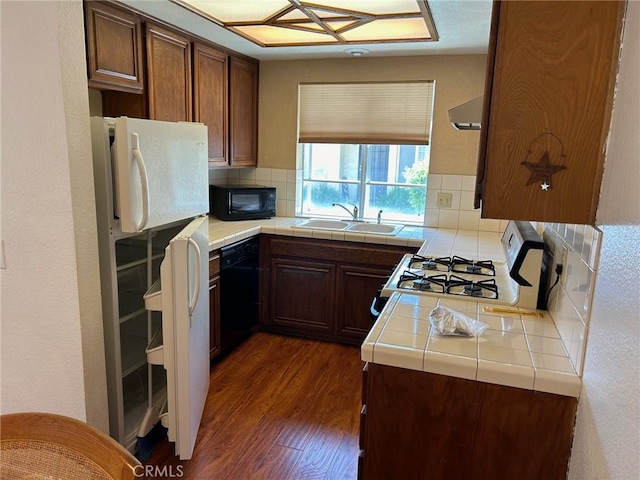 25879 Baylor Way, Hemet, CA 92544 - kitchen featuring black appliances, tile counters, dark wood-type flooring, backsplash, and exhaust hood