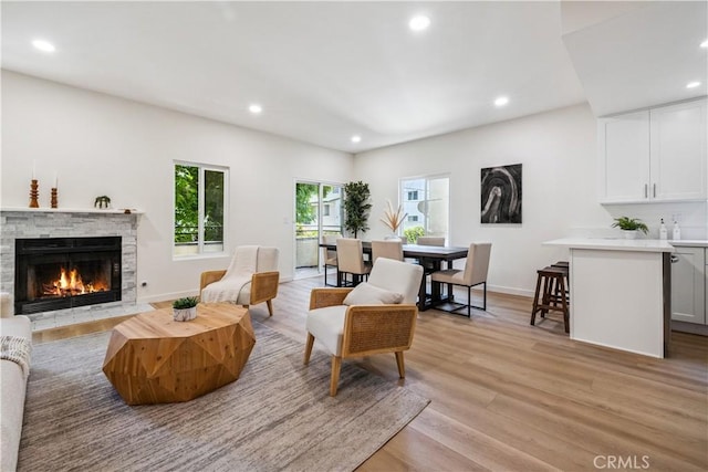 11722 Avon Way Unit 103, Los Angeles, CA 90066 - living area with recessed lighting, light wood finished floors, and a fireplace