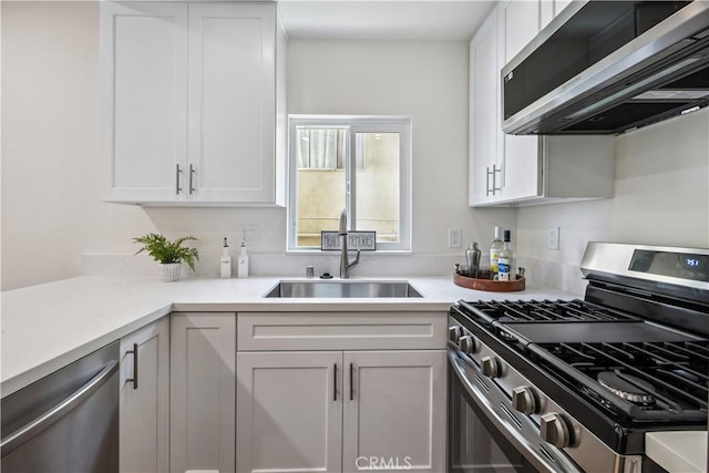 11722 Avon Way Unit 103, Los Angeles, CA 90066 - kitchen with stainless steel appliances, white cabinets, and light countertops