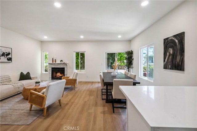 11722 Avon Way Unit 103, Los Angeles, CA 90066 - living area featuring light wood finished floors, recessed lighting, plenty of natural light, and a fireplace