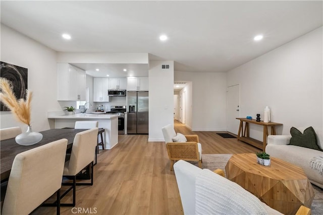 11722 Avon Way Unit 103, Los Angeles, CA 90066 - living room with light wood finished floors and recessed lighting