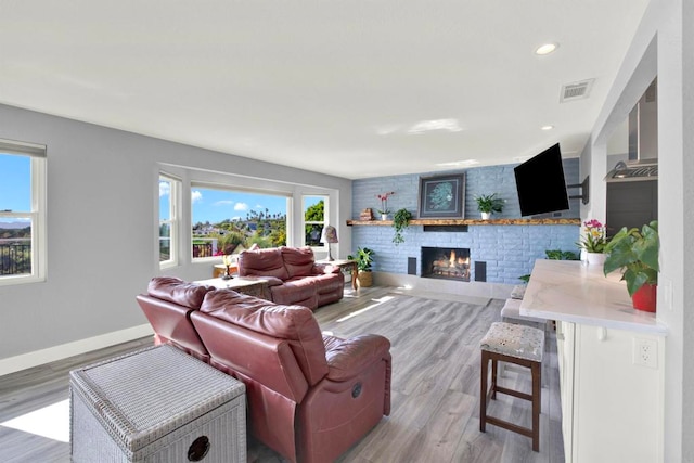 4710 Sleeping Indian Rd, Fallbrook, CA 92028 - living room featuring wood finished floors, a fireplace, and recessed lighting