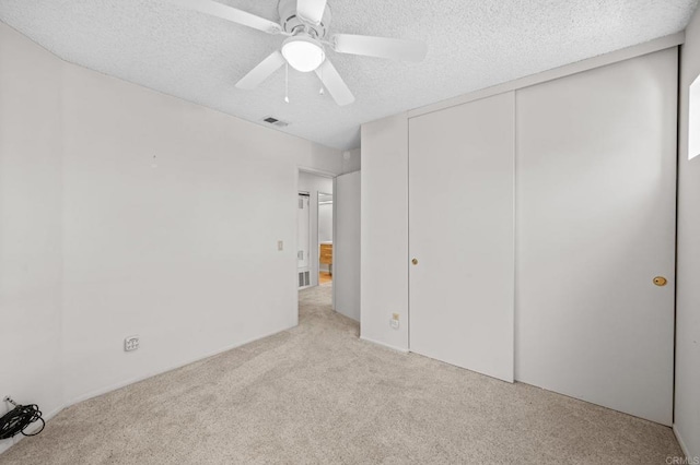 13292 Salmon River Rd Unit 204, San Diego, CA 92129 - unfurnished bedroom with light carpet, a textured ceiling, a closet, and ceiling fan