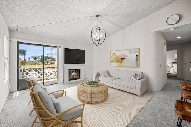 13292 Salmon River Rd Unit 204, San Diego, CA 92129 - living area with carpet, a textured ceiling, a premium fireplace, a chandelier, and vaulted ceiling