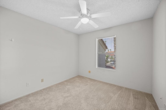 13292 Salmon River Rd Unit 204, San Diego, CA 92129 - spare room featuring carpet flooring, a ceiling fan, and a textured ceiling