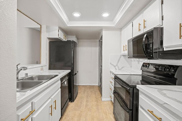 13292 Salmon River Rd Unit 204, San Diego, CA 92129 - kitchen with black appliances, ornamental molding, white cabinetry, light wood-style flooring, and a raised ceiling