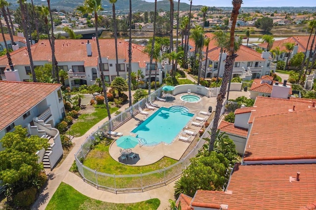 13292 Salmon River Rd Unit 204, San Diego, CA 92129 - aerial perspective of suburban area featuring a pool and a mountain backdrop