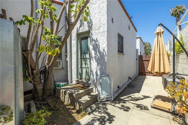 1928 Rosalia Rd, Los Angeles, CA 90027 - view of home's exterior featuring stucco siding and a patio area