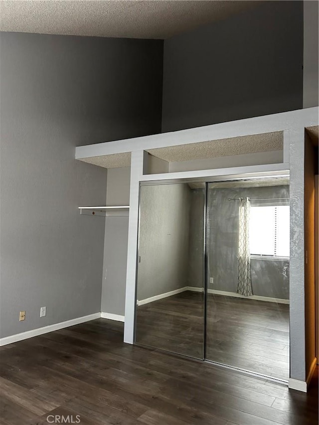 1 Appian Way Unit 710-6, South San Francisco, CA 94080 - unfurnished bedroom featuring wood finished floors and multiple closets