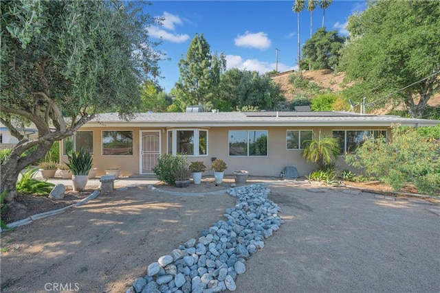 3777 N Arrowhead Ave, San Bernardino, CA 92405 - single story home featuring stucco siding and roof mounted solar panels