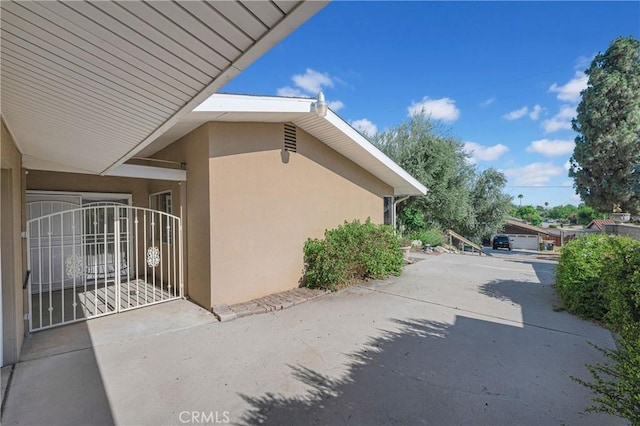 3777 N Arrowhead Ave, San Bernardino, CA 92405 - view of side of home featuring stucco siding