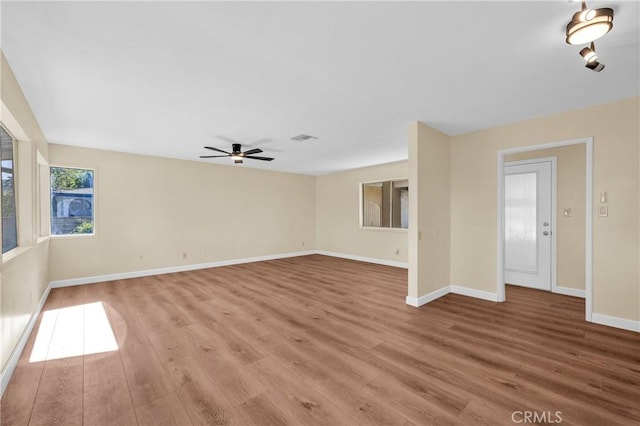 3777 N Arrowhead Ave, San Bernardino, CA 92405 - unfurnished living room featuring light wood-style flooring and ceiling fan