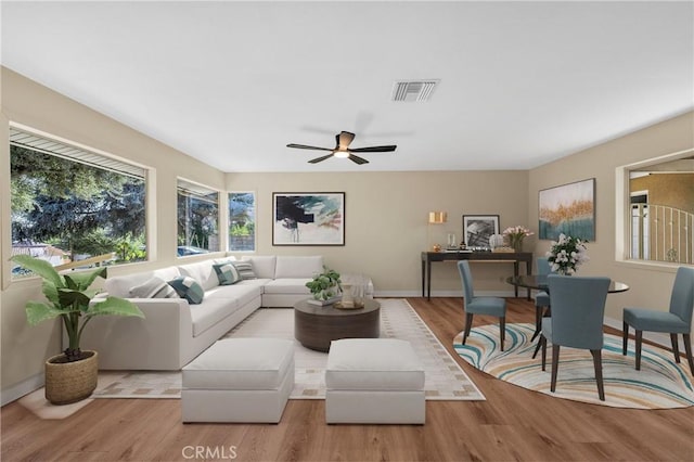 3777 N Arrowhead Ave, San Bernardino, CA 92405 - living room with wood finished floors and a ceiling fan