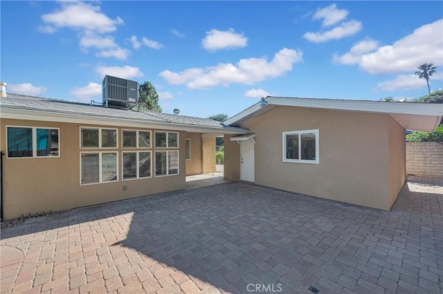 3777 N Arrowhead Ave, San Bernardino, CA 92405 - rear view of property with stucco siding and a patio