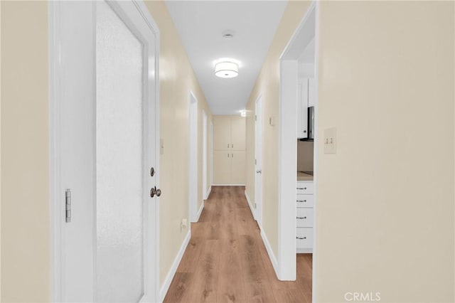 3777 N Arrowhead Ave, San Bernardino, CA 92405 - corridor featuring light wood finished floors and baseboards