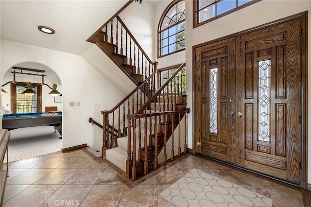 23511 Mirage Ln, Diamond Bar, CA 91765 - entrance foyer featuring healthy amount of natural light, arched walkways, and stairs