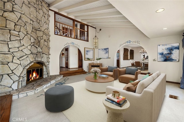 23511 Mirage Ln, Diamond Bar, CA 91765 - living area featuring arched walkways, carpet floors, a stone fireplace, and recessed lighting