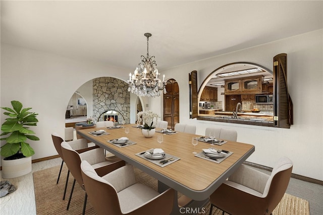 23511 Mirage Ln, Diamond Bar, CA 91765 - dining room with arched walkways and a chandelier