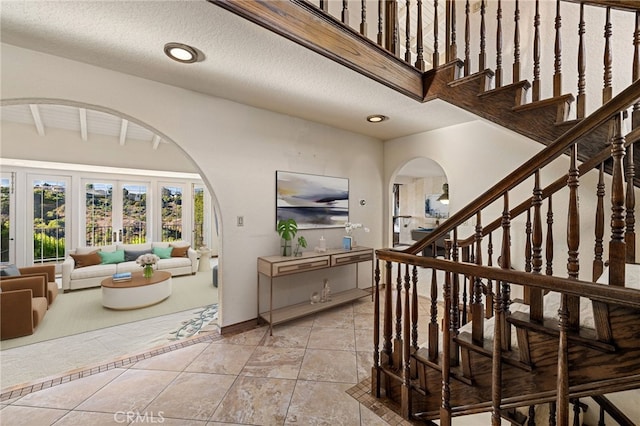 23511 Mirage Ln, Diamond Bar, CA 91765 - entrance foyer featuring arched walkways, stairs, recessed lighting, and light tile patterned floors