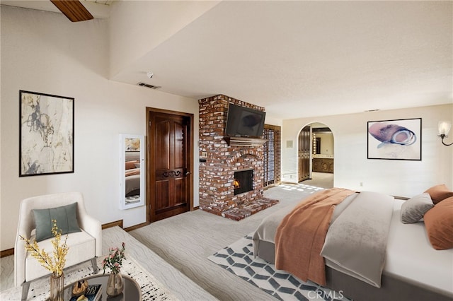 23511 Mirage Ln, Diamond Bar, CA 91765 - carpeted bedroom with arched walkways, a brick fireplace, and ensuite bathroom