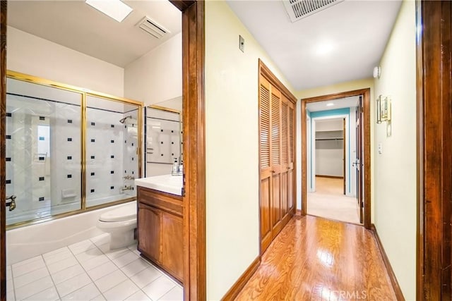 2008 S Bentley Ave Unit 5, Los Angeles, CA 90025 - full bath featuring shower / bath combination with glass door, vanity, a closet, and tile patterned floors