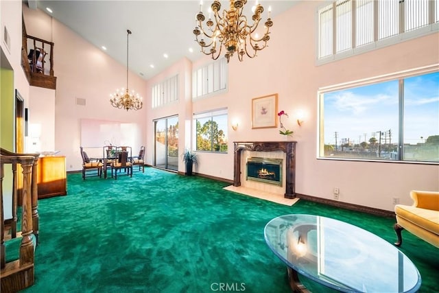 2008 S Bentley Ave Unit 5, Los Angeles, CA 90025 - carpeted living area featuring a chandelier, high vaulted ceiling, a fireplace, and recessed lighting