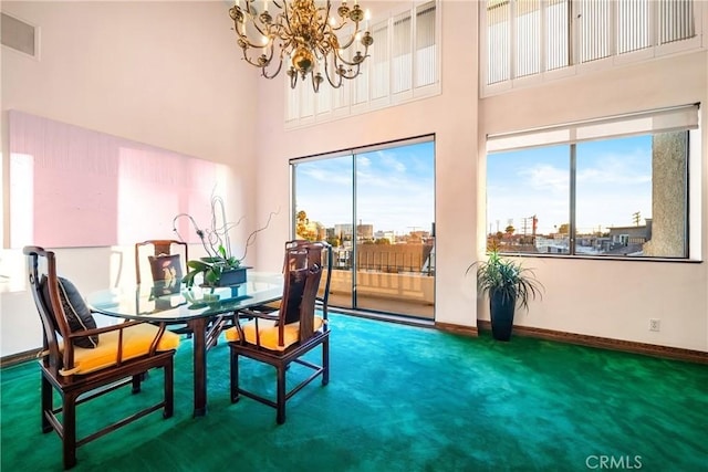 2008 S Bentley Ave Unit 5, Los Angeles, CA 90025 - carpeted dining area featuring a towering ceiling and a chandelier