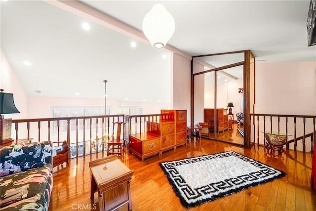2008 S Bentley Ave Unit 5, Los Angeles, CA 90025 - sitting room with hardwood / wood-style flooring and an upstairs landing