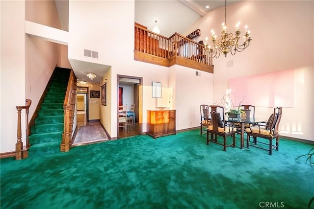 2008 S Bentley Ave Unit 5, Los Angeles, CA 90025 - carpeted dining space featuring a chandelier, stairway, and high vaulted ceiling