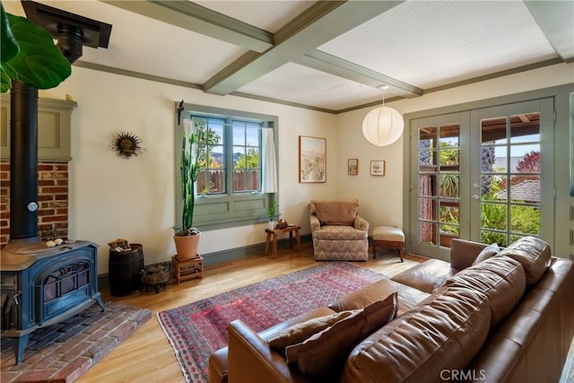 1521 5th St, Los Osos, CA 93402 - living area featuring healthy amount of natural light, beam ceiling, french doors, a wood stove, and wood finished floors