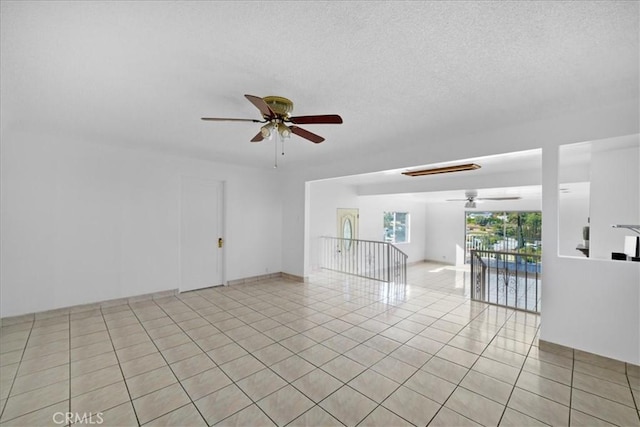 1745 College View Pl, Los Angeles, CA 90041 - empty room featuring ceiling fan, light tile patterned floors, and a textured ceiling