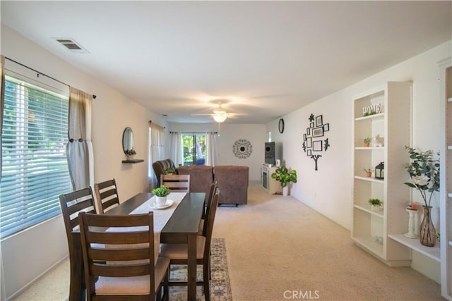 19078 Stoddard Way, Apple Valley, CA 92308 - dining space with light colored carpet and a ceiling fan