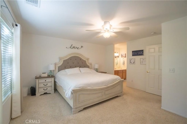 19078 Stoddard Way, Apple Valley, CA 92308 - bedroom with light colored carpet, a ceiling fan, and connected bathroom