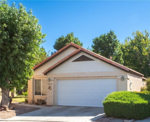 19078 Stoddard Way, Apple Valley, CA 92308 - ranch-style house featuring driveway, stucco siding, and a garage