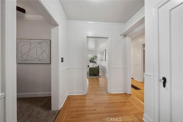 790 Manzanita St, Lakeport, CA 95453 - hallway featuring wainscoting, crown molding, and light wood finished floors