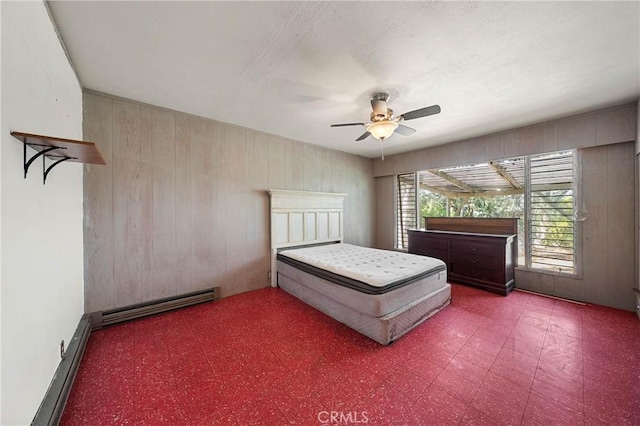 790 Manzanita St, Lakeport, CA 95453 - bedroom with a baseboard heating unit, wooden walls, and ceiling fan